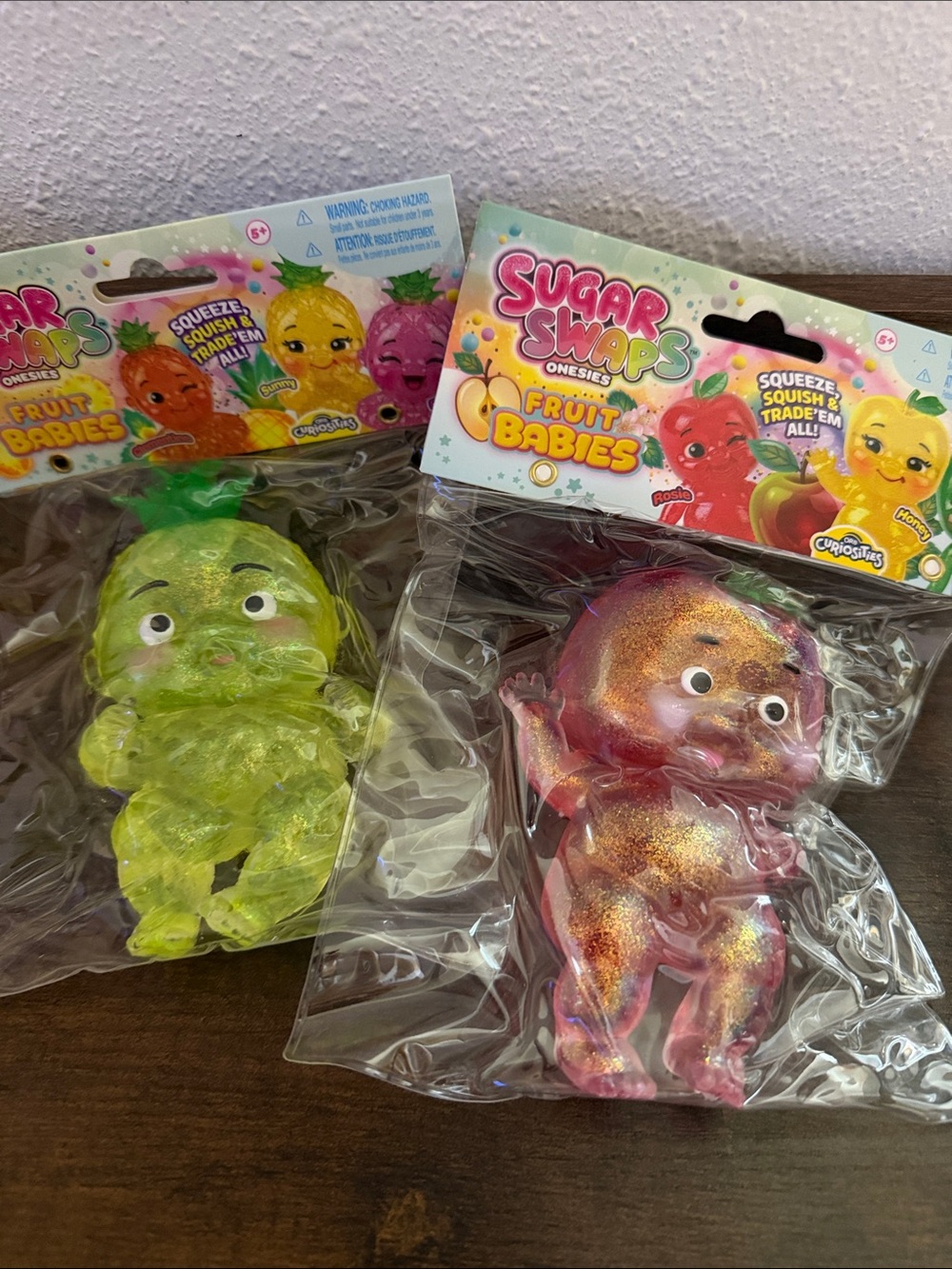 Set of 2 Sugar Swaps Fruit Babies Squishy Toys - Pineapple & Apple